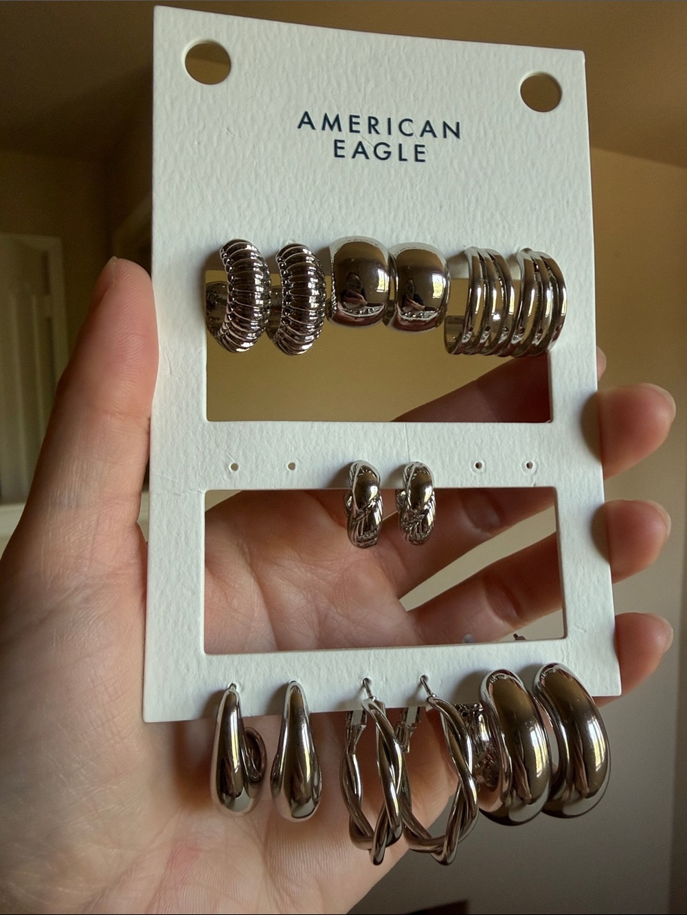 AE 7 pairs of silver earrings
